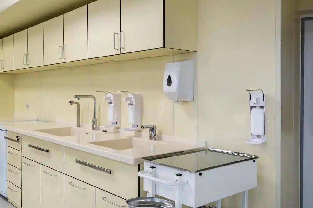 Clinical casework with sinks and hands-free dispensers installed during a medical office build-out