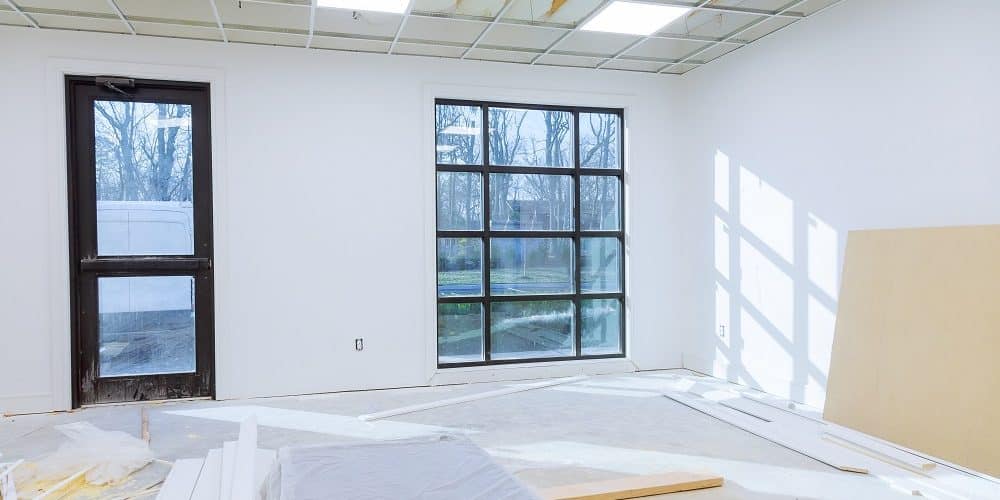 Making renovation of hung of suspended ceilings lights high in a bright modern office