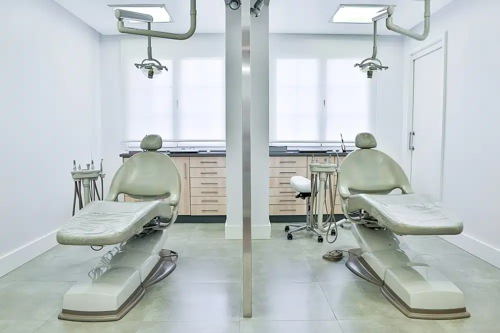 Dental operatory build-out with two chair stations and cabinetry in a New Orleans clinic